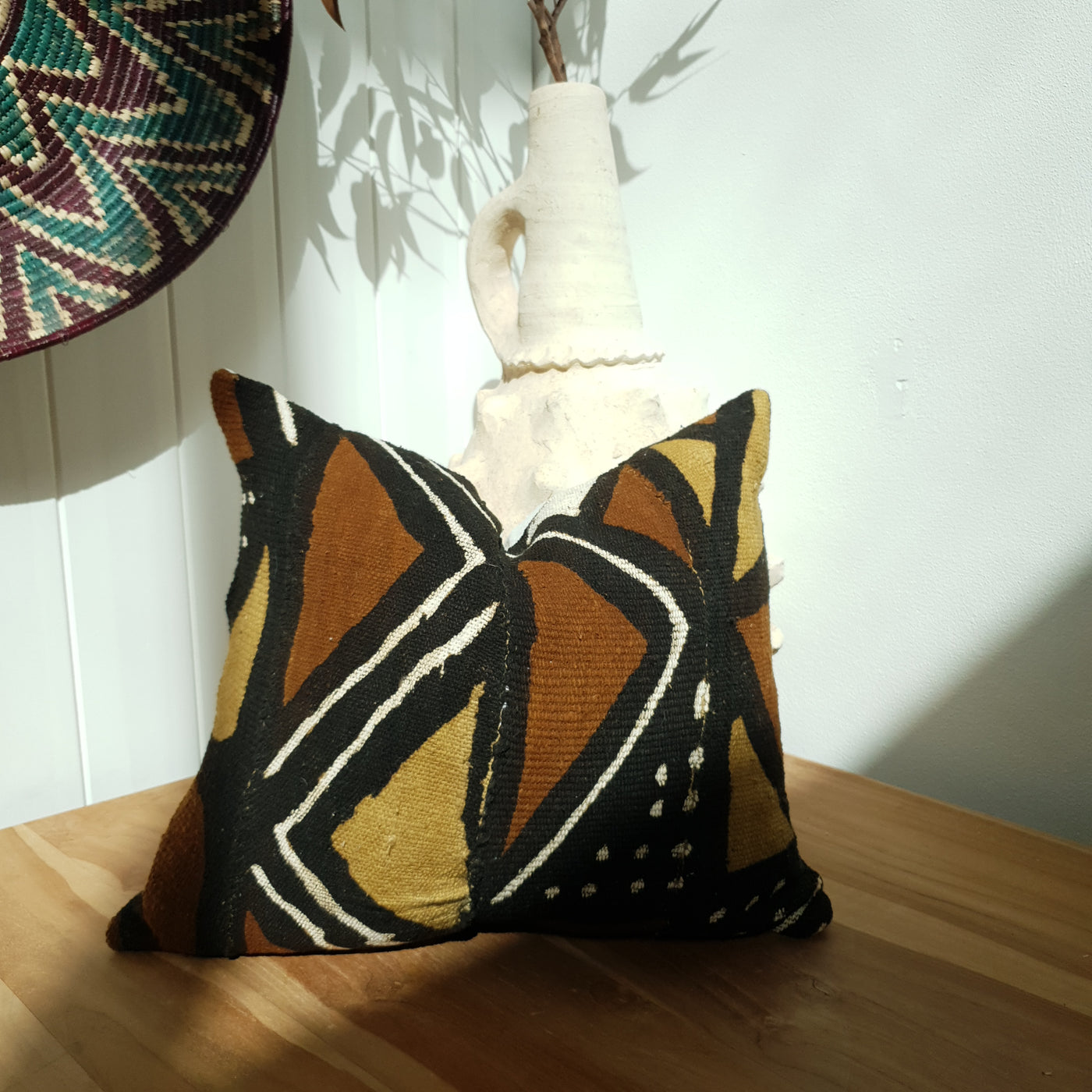 mudcloth cushion in the sunlight