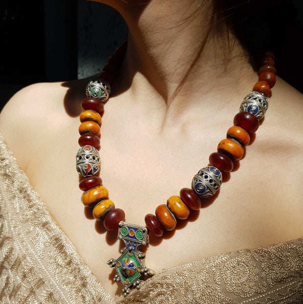 A Little Morocco, Necklace with Amber Beads and Vintage Enamel Pendant styled