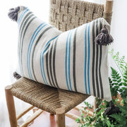 A LITTLE MOROCCO Pompom Cushion Blue and Brown Stripe Angled